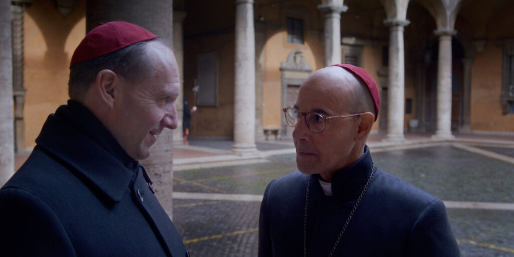 (L to R) Ralph Fiennes as Cardinal Lawrence and Stanley Tucci as Cardinal Bellini in director Edward Berger's CONCLAVE, a Focus Features release. Credit: Courtesy of Focus Features. © 2024 All Rights Reserved.