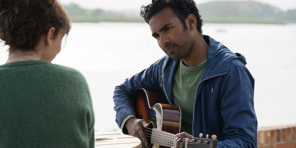(from left) Ellie (Lily James, back to camera) and Jack Malik (Himesh Patel) in "Yesterday," directed by Danny Boyle.