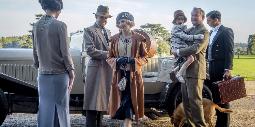 This image released by Focus features shows Elizabeth McGovern, from left, Harry Hadden-Paton, Laura Carmichael, Hugh Bonneville and Michael Fox, right, in a scene from "Downton Abbey." The highly-anticipated film continuation of the "Masterpiece" series that wowed audiences for six seasons, will be released Sept. 13, 2019, in the United Kingdom and on Sept. 20 in the United States. (Jaap Buitendijk/Focus Features via AP)